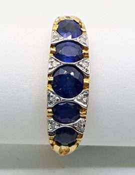 9ct gold ring 5 blue sapphires with diamonds in a Bridge setting
