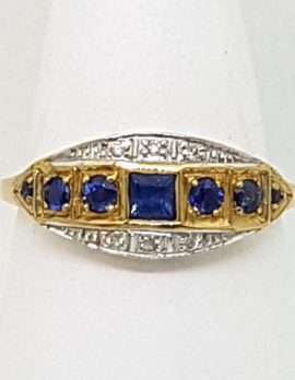 square blue sapphire with 6 rounds sapphires on 9ct gold ring