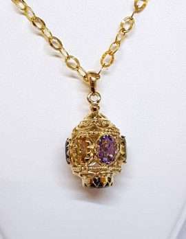 ornate gold spherical drop pendant with 3 gems