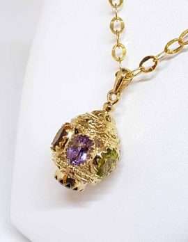 ornate gold spherical drop pendant with 3 gems amethyst citrine and peridot