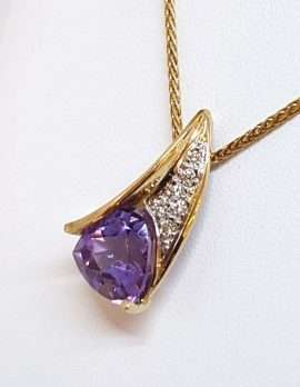 gold necklace with heart shape amethyst and diamonds
