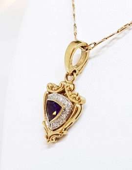 gold necklace amethyst and diamonds with crest design