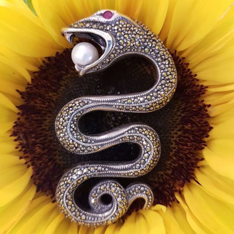 Sterling Silver and marcasite brooch - snake with ruby eye and pearl in mouth