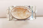 Sterling Silver Oval Rutilated Quartz in Wide Band Ring with Wave Design