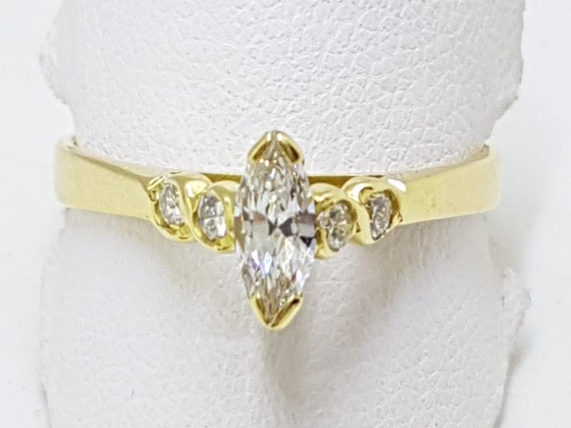 18ct Gold Marquis Cut Diamond with 4 Round Diamonds Engagement Ring