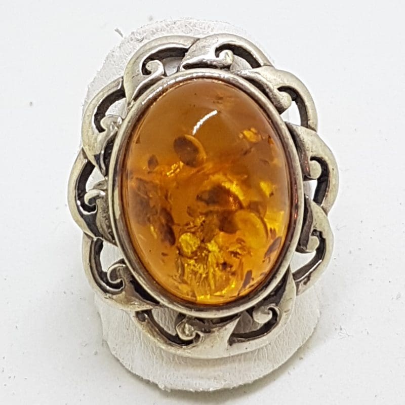Sterling Silver Large Oval Natural Amber Ring with Twist Design