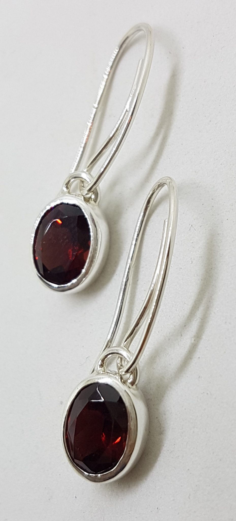 Sterling Silver Bezel Set Oval Garnet Drop Earrings