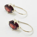 Sterling Silver Oval Claw Set Garnet Drop Earrings