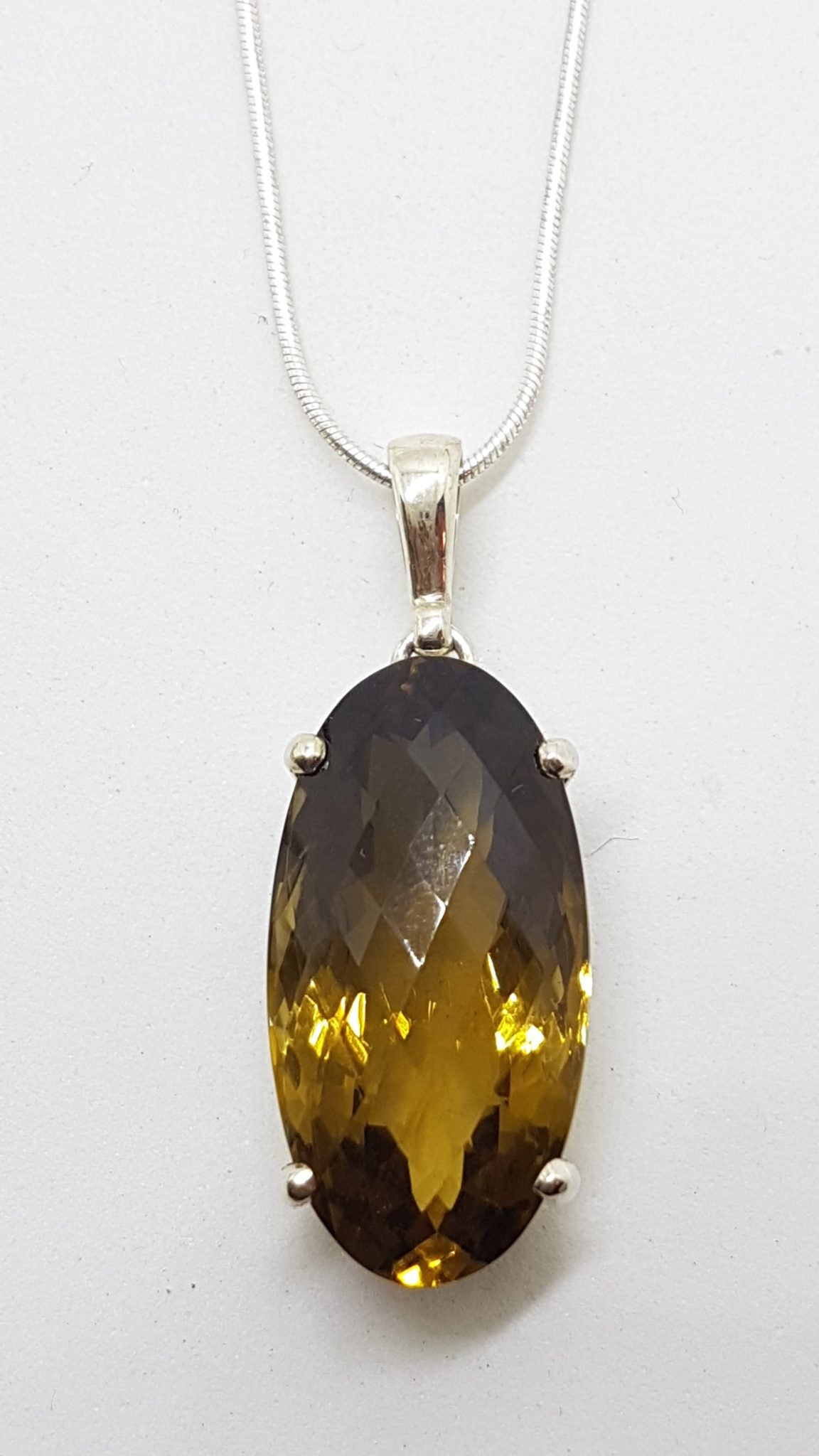 Sterling Silver Claw Set Oval Smokey Quartz Pendant on Silver Chain