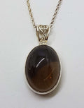 Sterling Silver Oval Bezel Set Cabochon Cut Smokey Quartz Ornate Sides Pendant on Silver Chain