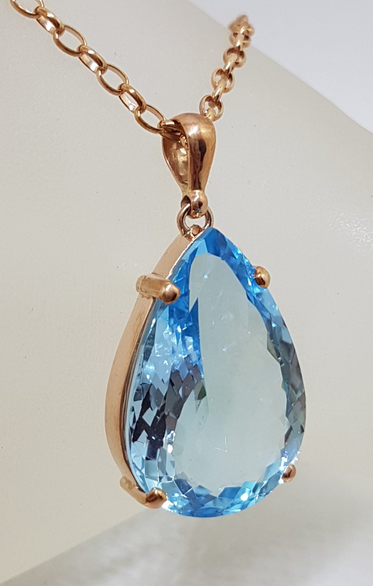 9ct Rose Gold Teardrop Blue Topaz Pendant on 9ct Chain
