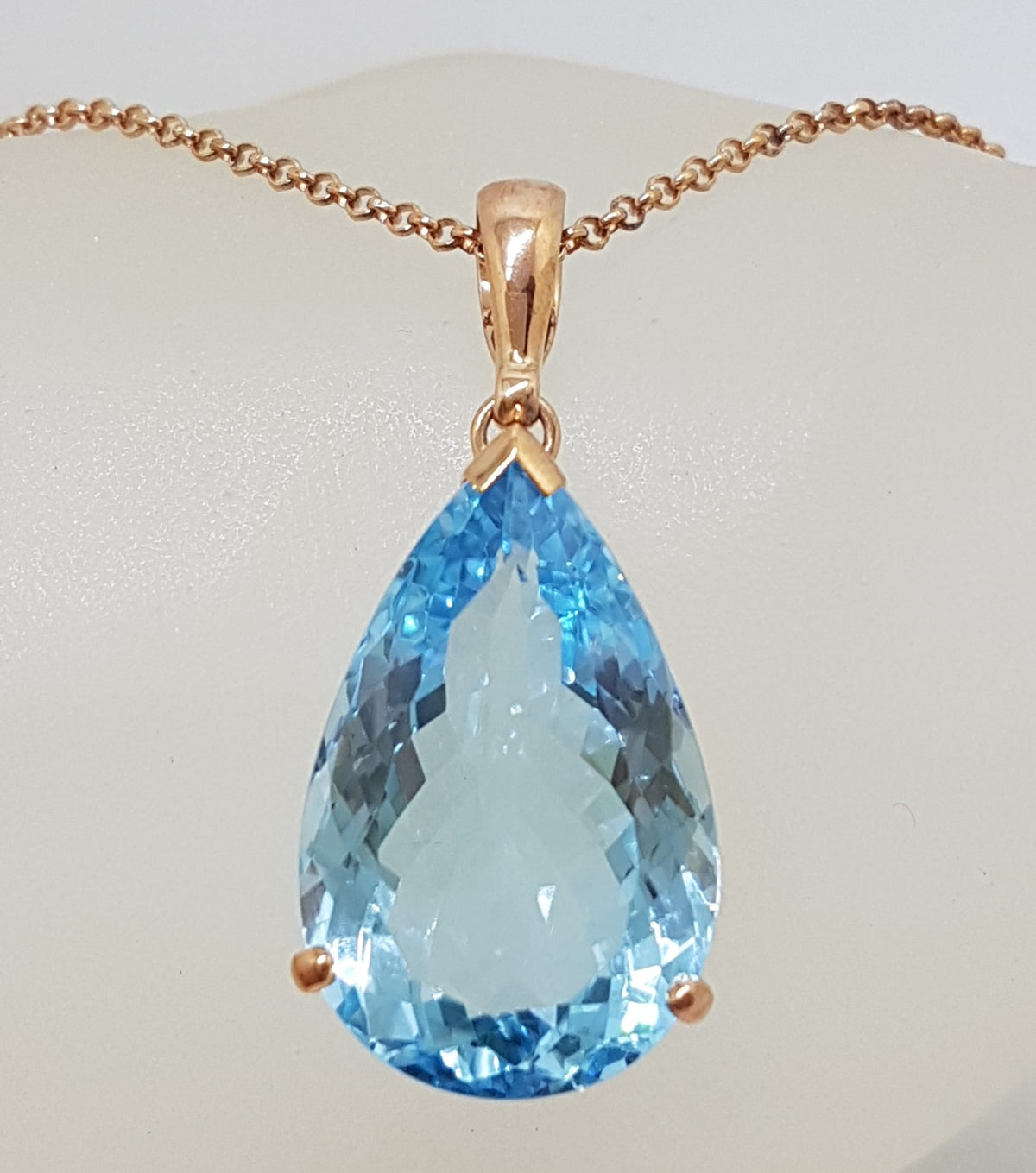9ct Rose Gold Large Teardrop Shape Blue Topaz Pendant on 9ct Chain