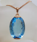 9ct Rose Gold Large Oval Blue Topaz Pendant on 9ct Chain