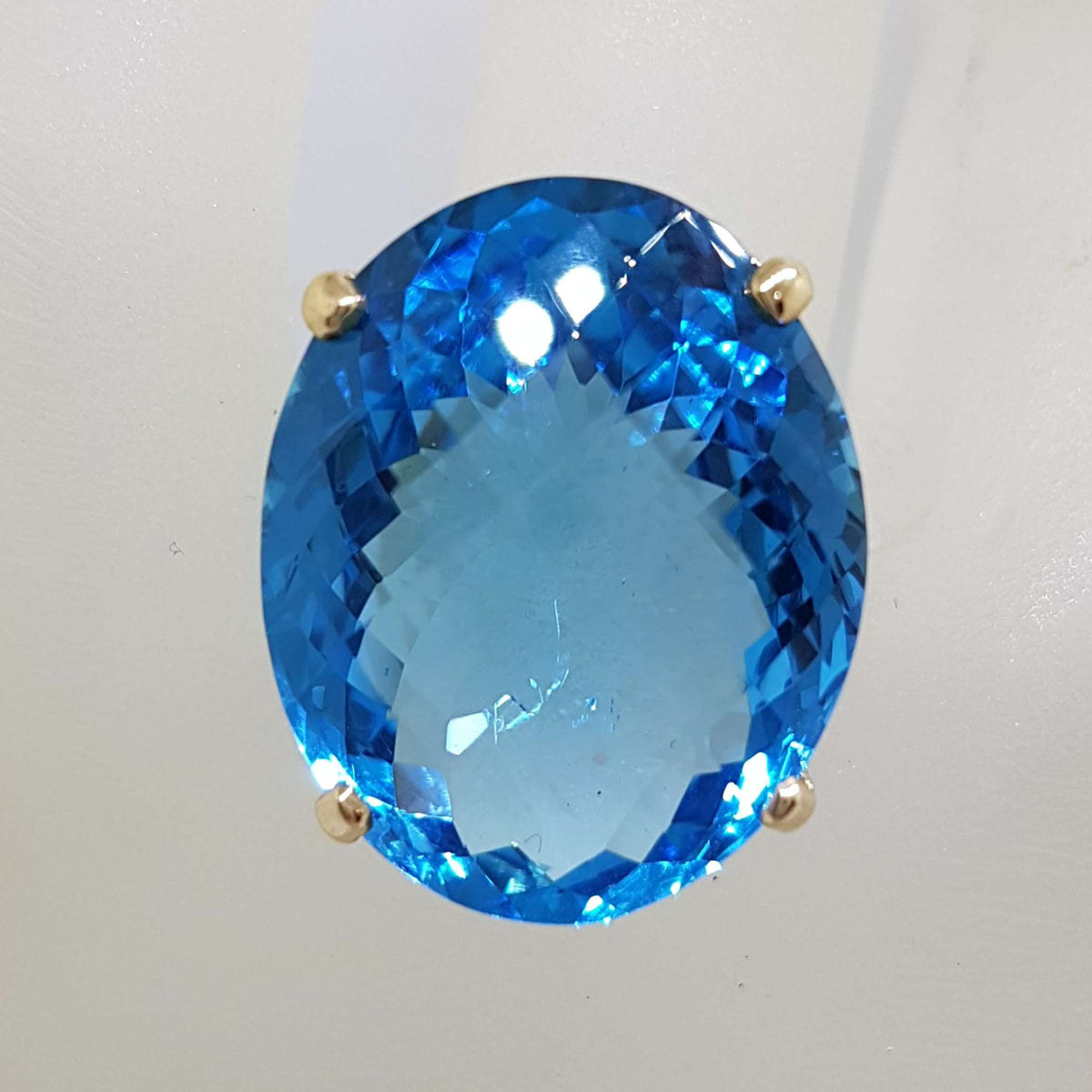 9ct Yellow Gold Large Oval Deep Blue Cushion Cut Topaz Claw Set Cocktail Ring