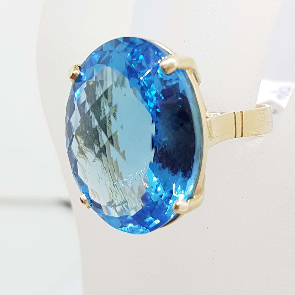 9ct Yellow Gold Large Oval Deep Blue Cushion Cut Topaz Claw Set Cocktail Ring