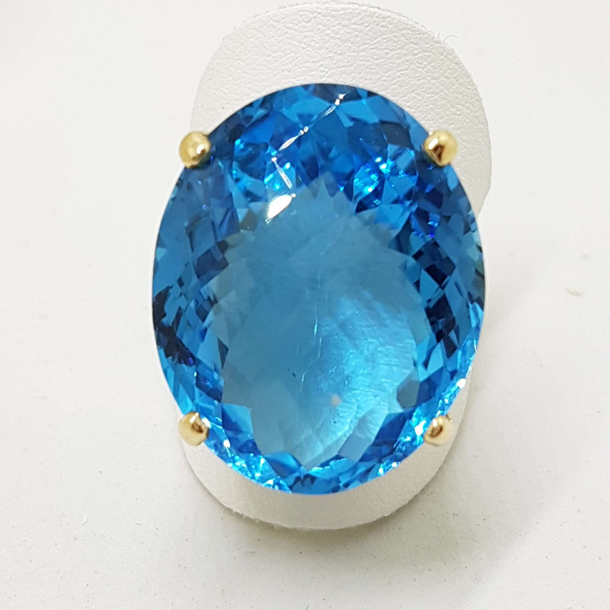 9ct Yellow Gold Large Oval Deep Blue Cushion Cut Topaz Claw Set Cocktail Ring