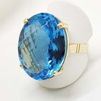 9ct Yellow Gold Large Oval Deep Blue Cushion Cut Topaz Claw Set Cocktail Ring