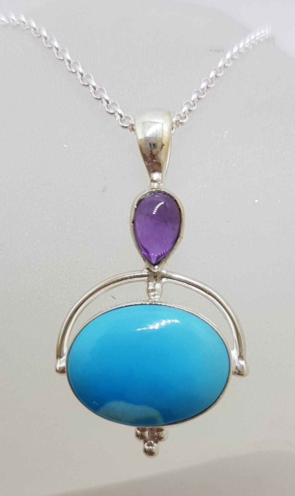 Sterling Silver Oval Natural Sleeping Beauty Turquoise with Cabochon Amethyst Pendant on Silver Chain
