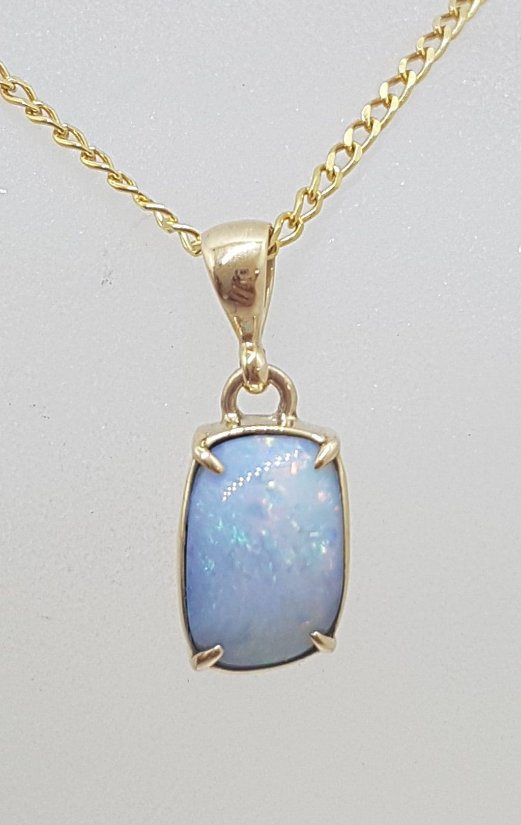 9ct Yellow Gold Rectangular Blue Opal Claw Set Pendant on Gold Chain