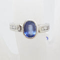 18ct White Gold Oval Bezel Set Natural Blue Ceylon Sapphire with Channel Set Diamond Ring