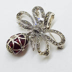Sterling Silver Marcasite and Red Enamel Egg Drop on Ornate Bow Enhancer Pendant / Brooch