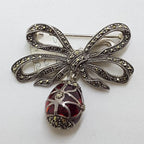 Sterling Silver Marcasite and Red Enamel Egg Drop on Ornate Bow Enhancer Pendant / Brooch