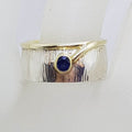 Sterling Silver and Plated Wide Patterned Band Ring with Oval Sapphire
