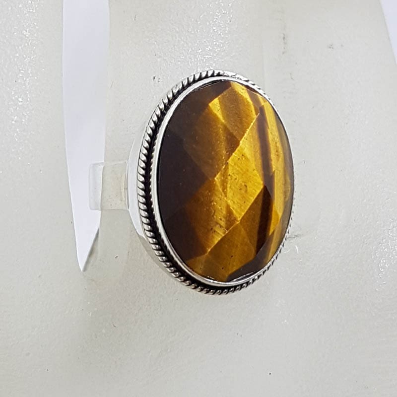 Sterling Silver Large Oval Faceted Tiger Eye Ring - Patterned Rim