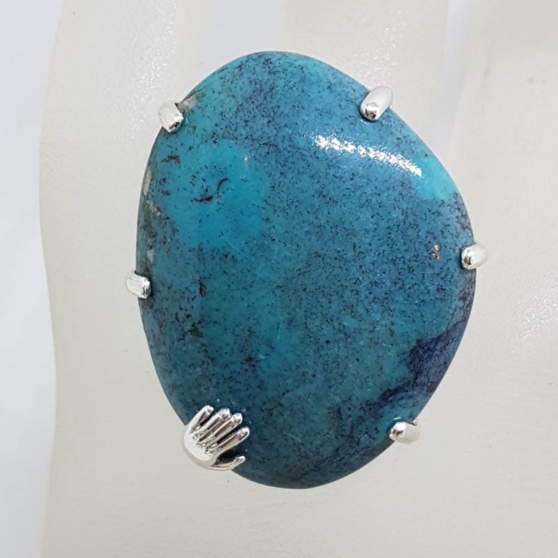 Sterling Silver Very Large Freeform Shape Natural Turquoise Claw Set Ring with Hand on Side