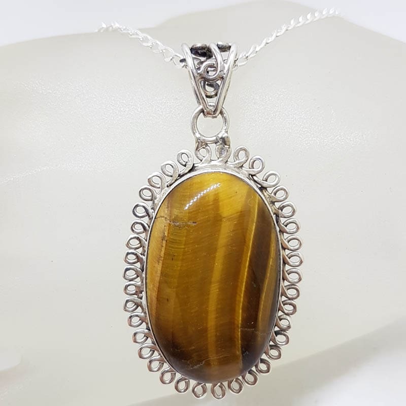 Sterling Silver Tiger Eye Cabochon Cut Oval Twist Rim Pendant on Silver Chain