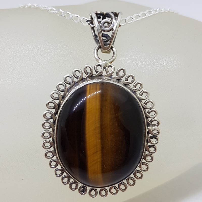 Sterling Silver Tiger Eye Cabochon Cut Oval Twist Rim Pendant on Silver Chain
