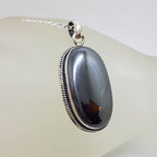 Sterling Silver Iron Ore / Hematite Bezel Set Oval with Twist Design on Rim Pendant on Silver Chain