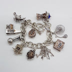 Sterling Silver 10 Charms Bracelet - Vintage / Antique - Including Church, Bible, Hedgehog and Genie Lamp