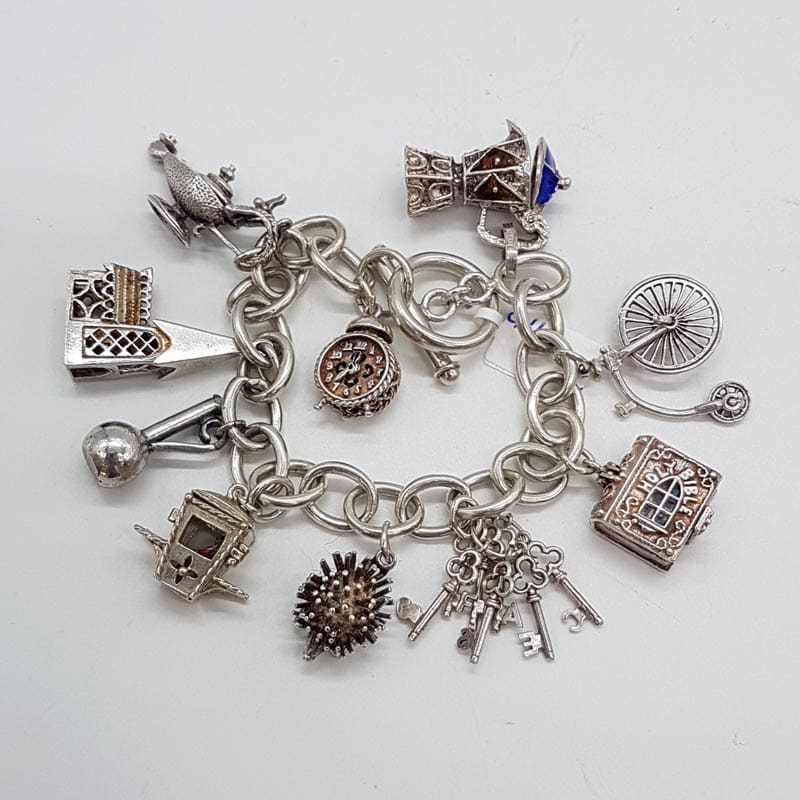 Sterling Silver 10 Charms Bracelet - Vintage / Antique - Including Church, Bible, Hedgehog and Genie Lamp