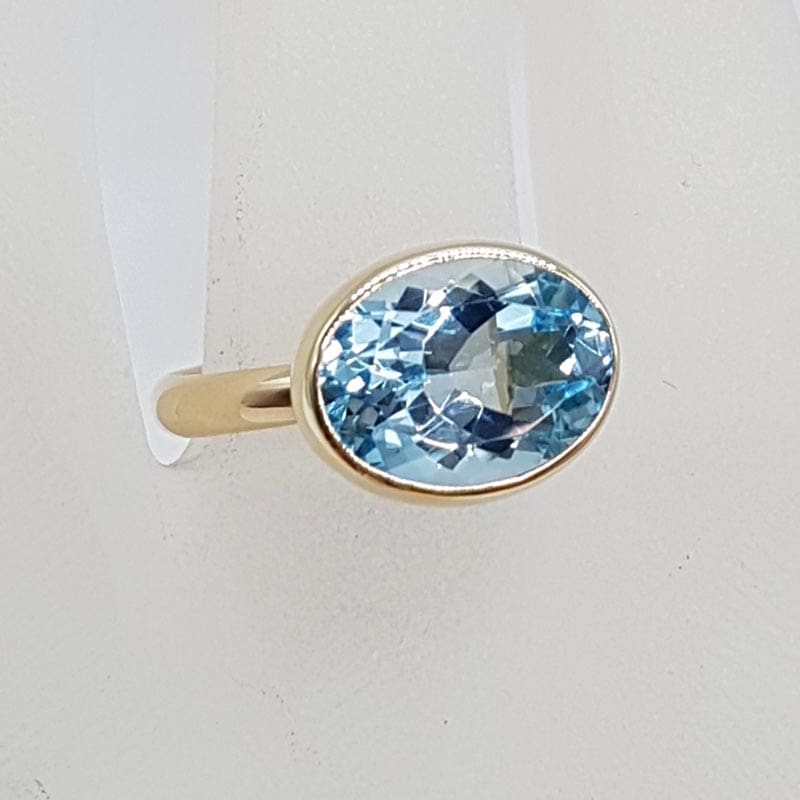 9ct Yellow Gold Topaz Blue Large / High Oval Bezel Set Ring