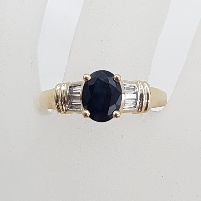 9ct Yellow Gold Oval Natural Sapphire Claw Set with Channel Set Diamonds Ring