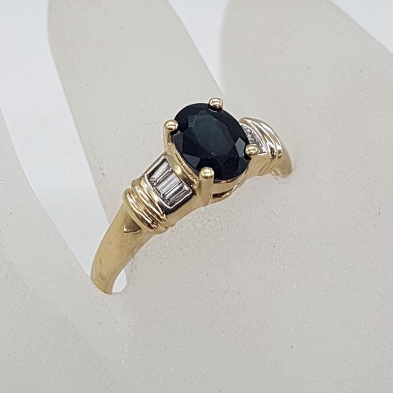 9ct Yellow Gold Oval Natural Sapphire Claw Set with Channel Set Diamonds Ring