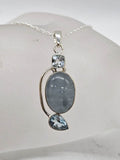 Sterling Silver Aquamarine and Topaz Twist Pendant on Silver Chain
