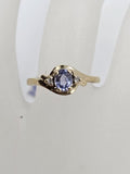 9ct Yellow Gold Oval Tanzanite and Diamond Twist Ring