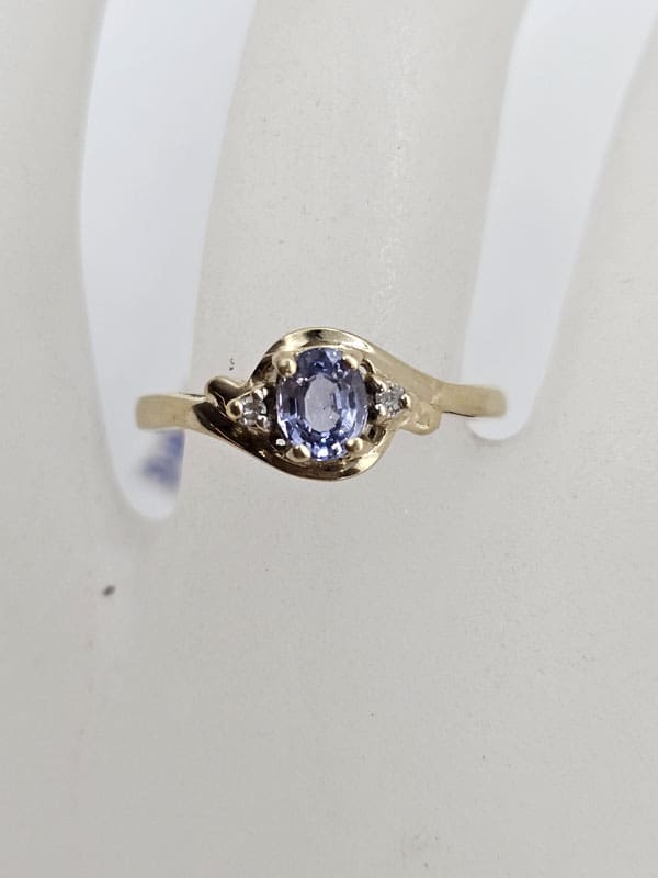 9ct Yellow Gold Oval Tanzanite and Diamond Twist Ring
