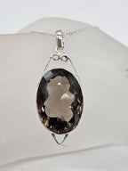 Sterling Silver Smokey Quartz Oval Shape Pendant with Ornate Open Design on Silver Chain