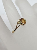 9ct Yellow Gold Oval Citrine with Two Peridots Claw Set Ring