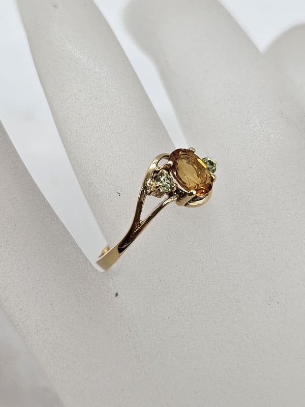 9ct Yellow Gold Oval Citrine with Two Peridots Claw Set Ring