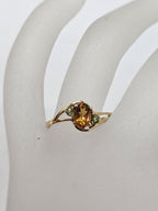 9ct Yellow Gold Oval Citrine with Two Peridots Claw Set Ring