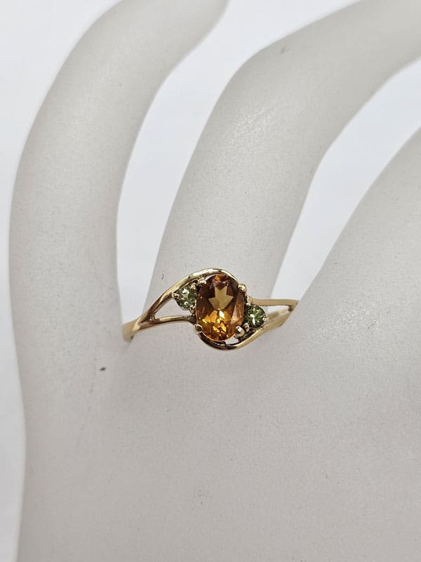 9ct Yellow Gold Oval Citrine with Two Peridots Claw Set Ring