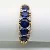 9ct gold ring 5 blue sapphires with diamonds in a Bridge setting