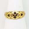 Four small black sapphires inset on 9ct gold ring in cross pattern