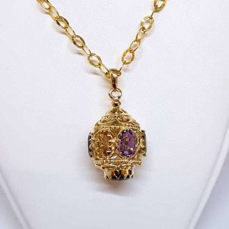 ornate gold spherical drop pendant with 3 gems