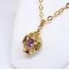 ornate gold spherical drop pendant with 3 gems amethyst citrine and peridot