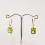 9ct gold earrings featuring faceted rectangular peridot
